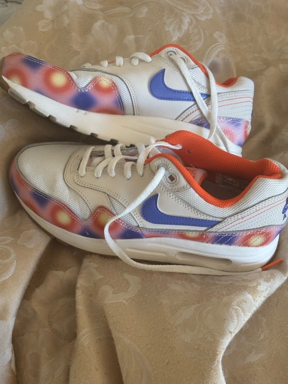 Nike White Sneakers with Purple Swoosh and Orange Lining